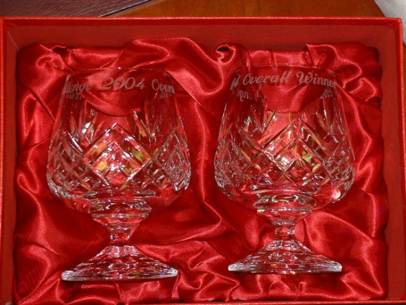 Image of engraved Crystal Glasses against red background